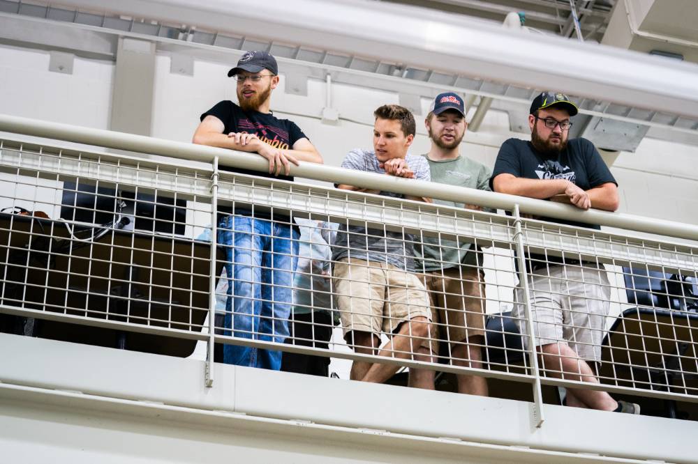 Students watch the boat races from the gallery above